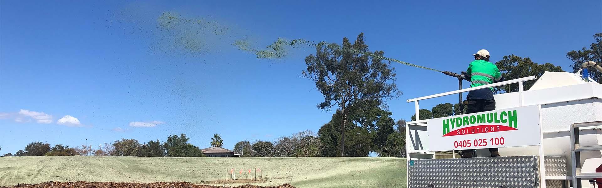 person spraying hydromulch